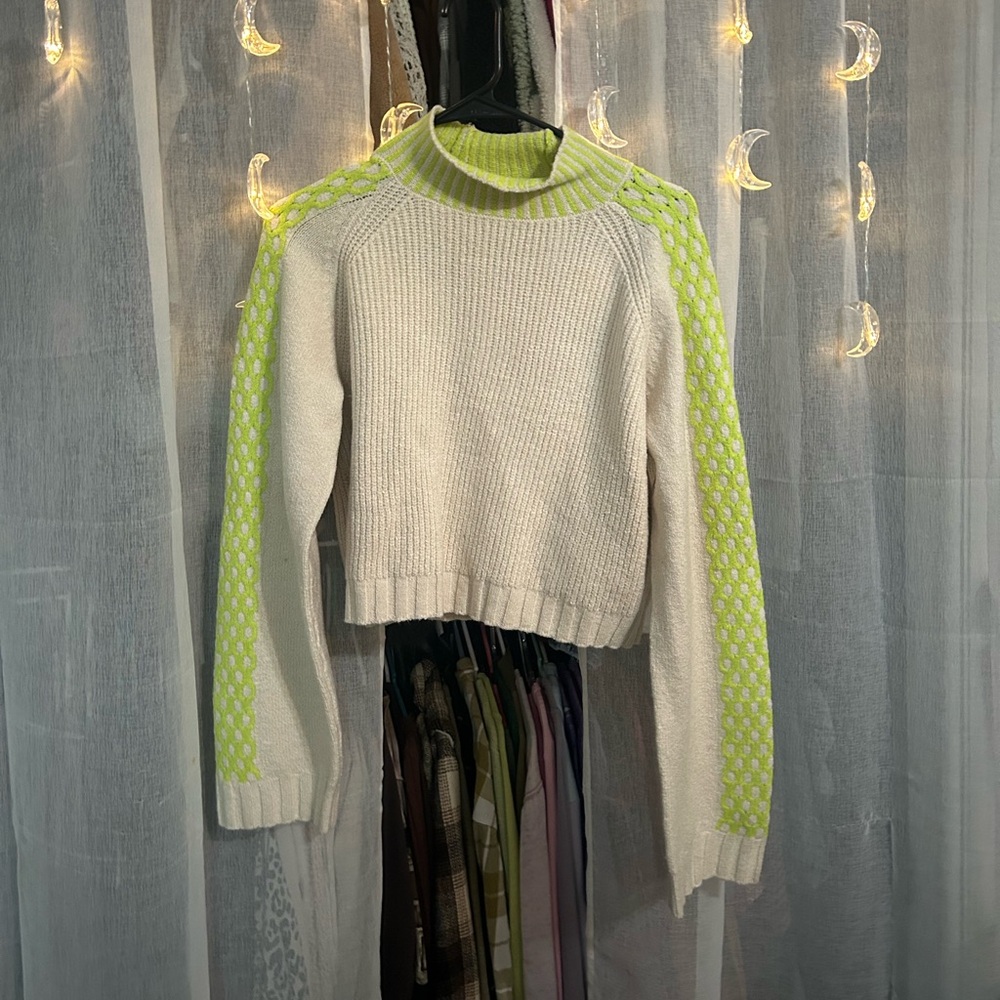 green and white turtleneck sweater